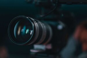 Professional school cctv video camera lens in focus with blurred background.