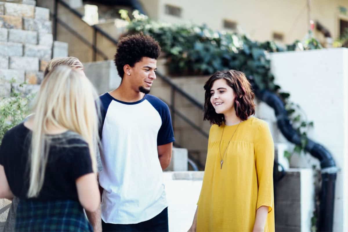 What is social emotional learning? A guide for parents 4 A group of young people engaging in social emotional learning activities in front of a building.