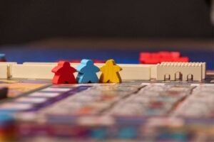 An educational board game with colorful figures.