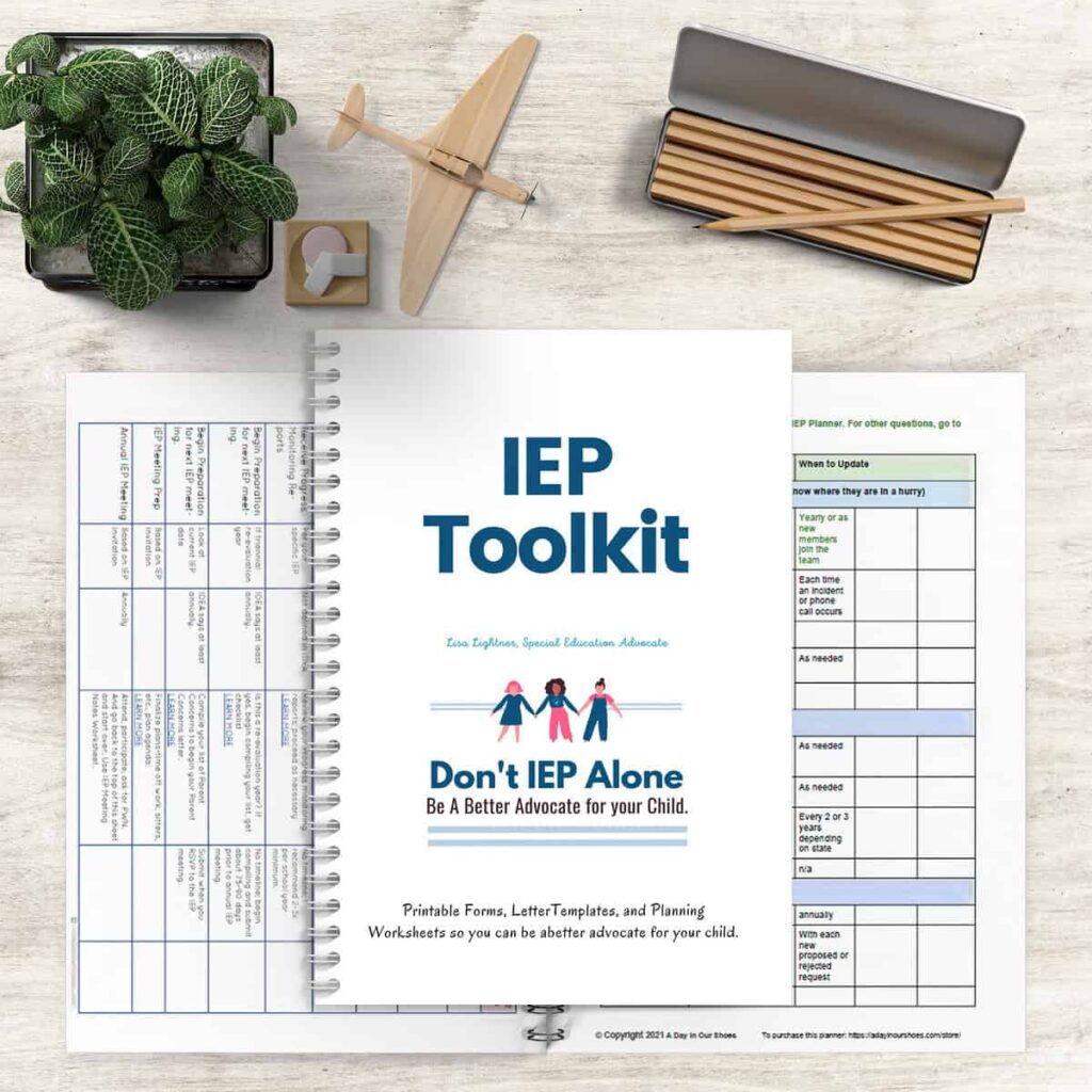 A day in our shoes and don't iep alone 56 A desk with a "special education iep toolkit" planner, wooden airplane model, potted plant, and pencils, suggesting planning and organization for individual educational programs.