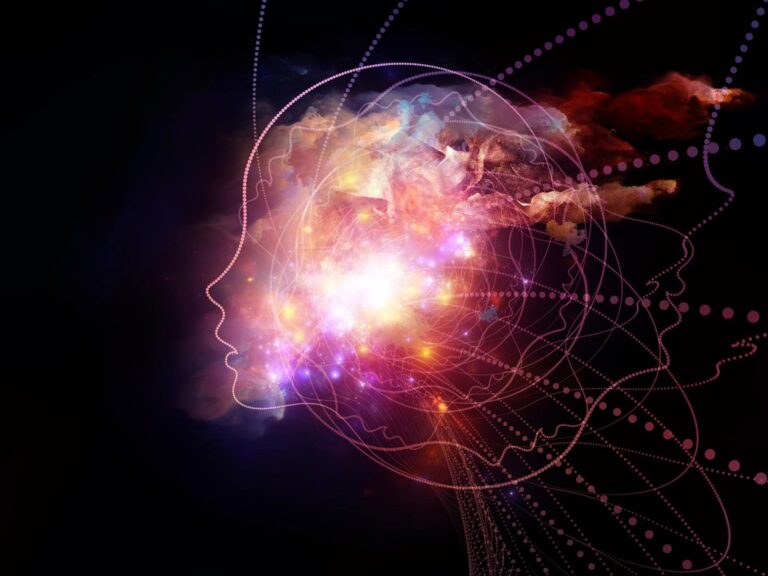 Abstract image of a human profile with colorful lights and clouds emanating from the head, symbolizing ai-driven creativity and ideas, akin to the process of writing an iep, on a dark background.