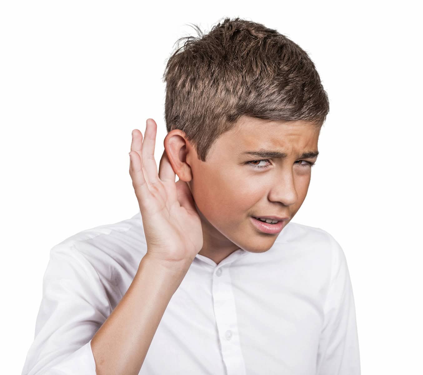 A young boy covering his ear with his hand, showing challenges with listening comprehension.