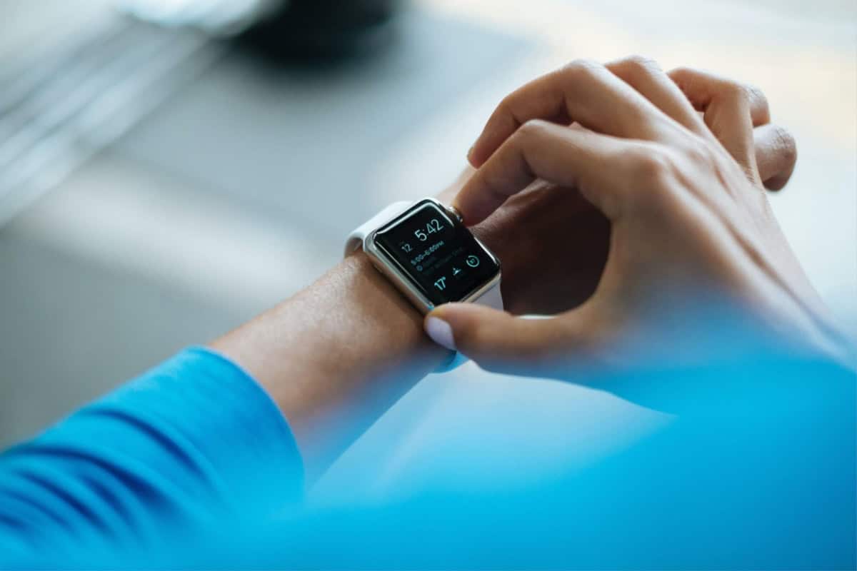 25 measurable telling time iep goals 2 A person is telling time on a smartwatch while holding their wrist with the other hand, aligning with their iep goals.
