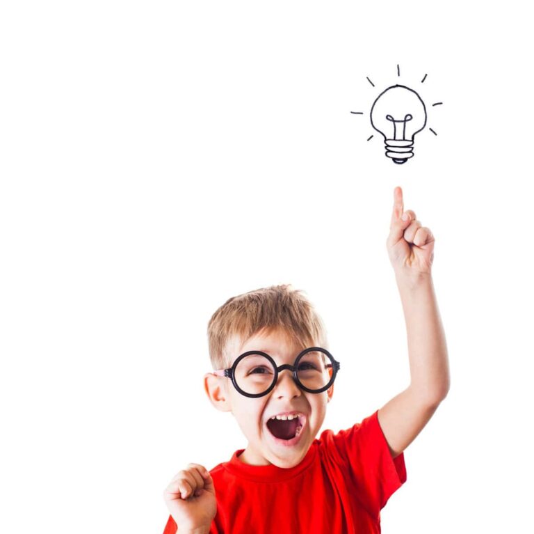 Child in glasses and red shirt pointing up with an excited expression, showcasing their higher-level thinking skills, with a light bulb illustration glowing above their finger.