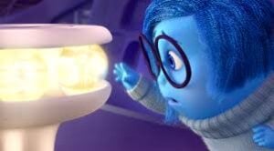 A blue animated character with glasses looks curiously at glowing orbs on a pedestal, guarding what seem to be core memories.
