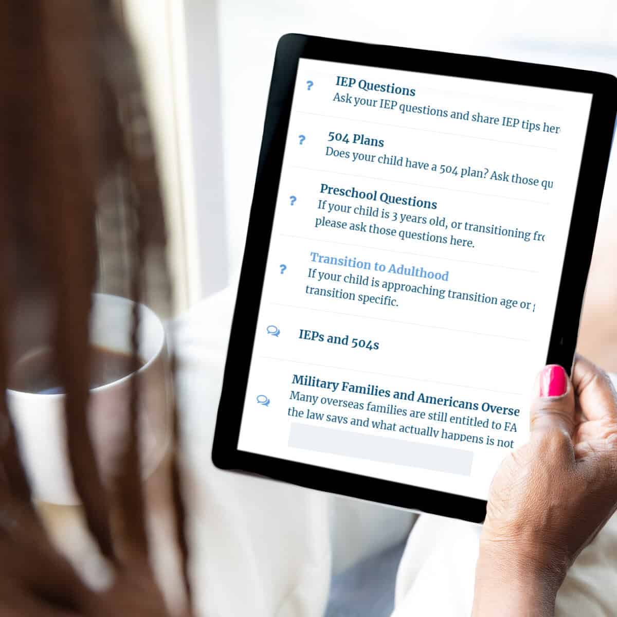 A person holds a tablet showing a webpage from "a day in our shoes" with topics on iep questions, 504 plans, preschool options, transition to adulthood, and support for military families.