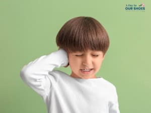 Child practicing interoception activities by noticing body signals like heartbeat, breathing, hunger, and temperature.