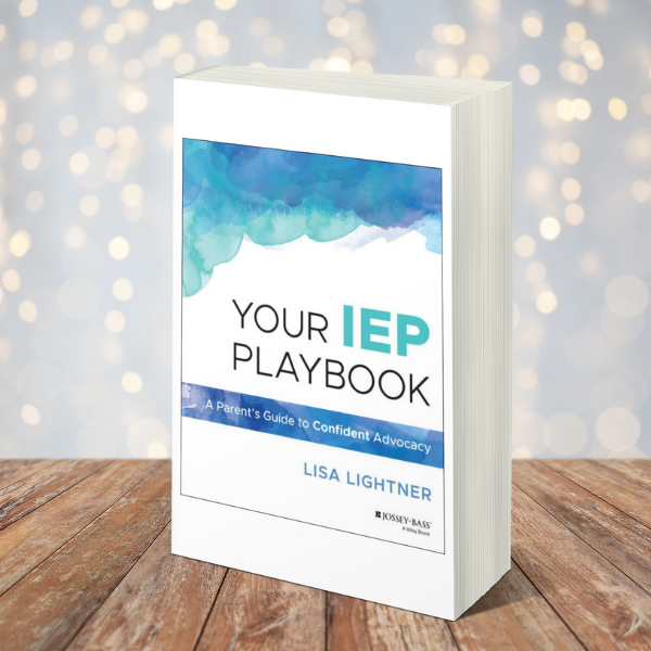 A book titled "your iep playbook: a parent's guide to confident advocacy" by lisa lightner is displayed on a wooden surface with a blurred, light-filled background.