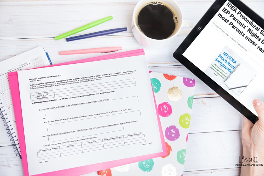 A person holding a tablet displaying an article about idea procedural safeguards, with paperwork, colorful pens, a coffee cup, and a notebook on a desk—highlighting how families can push back when schools question private evaluations.