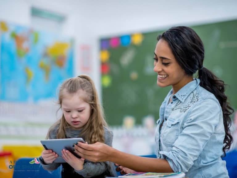 Student using an ipad as assistive technology in the classroom
