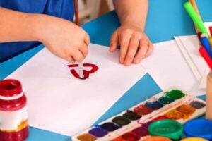 A child does an inclusive valentine's day activity