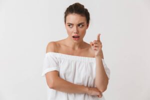 A young woman pointing her finger at the camera while advocating for iep changes.
