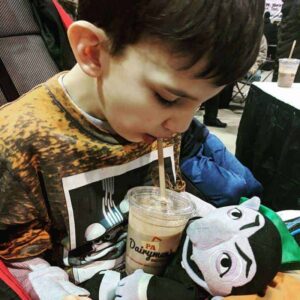 Farm show milkshake boy enjoying a milk shake from pa dairymens while holding his the count sesame street