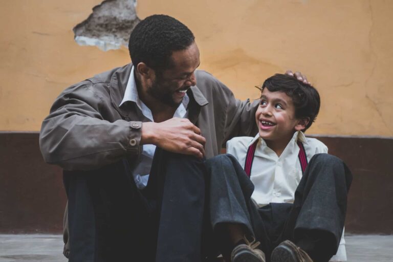 A father and son having conversation and working on speech and language skills.