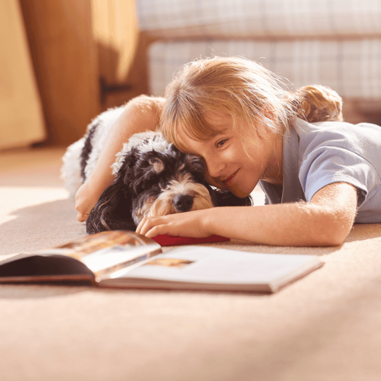 A child may resist reading with adults but enjoy reading to her dog.
