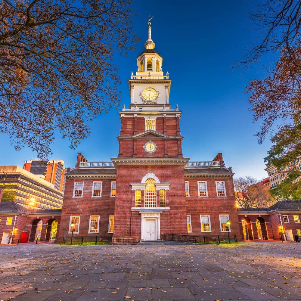 20 patriotism activities for students 8 A red brick building with a clock tower in the background, providing sensory-friendly experiences in philadelphia.