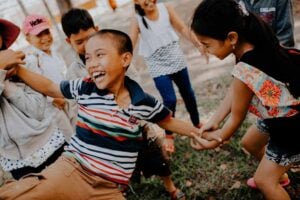 A child who lacks proprioception may bump into their friends frequently.
