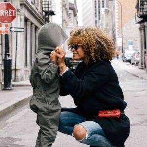 Mom tying a child's hood