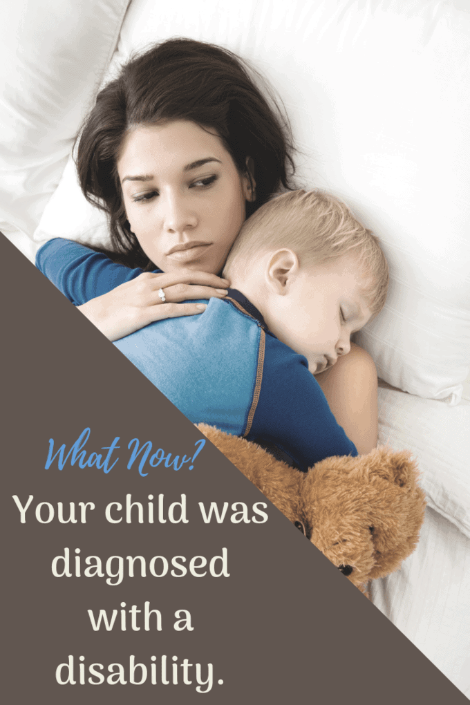 Child newly diagnosed with a disability mother holding her sleeping child