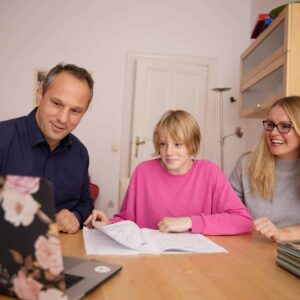 Arents helping a child with homework