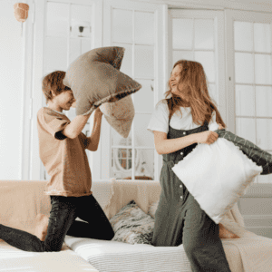 A pillow fight can be a really fun way to encourage your teen to cross midline.